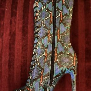 Snakeskin multi colored, pointy toe boots. Zipper closure. Worn once